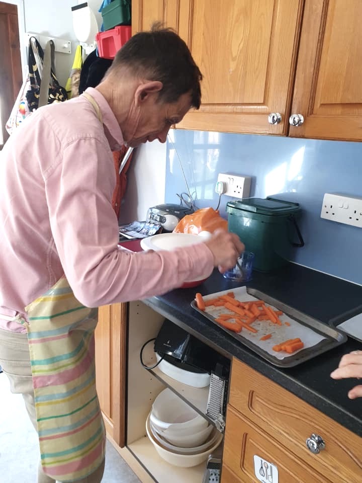 Clive helping cook dinner